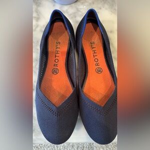 Rothy's Dark Blue Flats with Bright Orange Interior